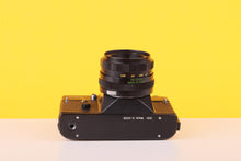 Load image into Gallery viewer, Zenit TTL 35mm SLR 35mm Film Camera with Helios-44M 58mm f/2 Lens
