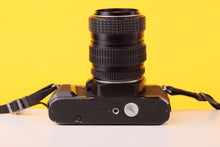 Load image into Gallery viewer, Pentax P30 35mm SLR Film Camera with SMC Pentax-M 28–50mm f/3.5–4.5 Zoom Lens
