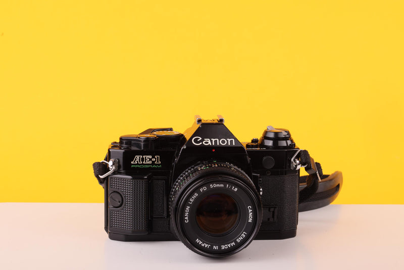 Canon AE-1 Program Black 35mm Film Camera with Canon FD 50mm f/1.8 Lens