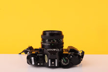 Load image into Gallery viewer, Canon AE-1 Program Black 35mm Film Camera with Canon FD 50mm f/1.8 Lens
