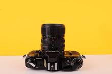 Load image into Gallery viewer, Canon AE-1 Black 35mm SLR Film Camera with Canon FD 35-70mm f/3.5-4.5 Zoom Lens
