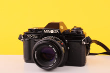 Load image into Gallery viewer, Minolta X-7A 35mm SLR Film Camera with MD 50mm f/1.7 Lens
