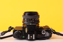 Load image into Gallery viewer, Minolta X-7A 35mm SLR Film Camera with MD 50mm f/1.7 Lens
