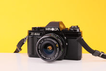 Load image into Gallery viewer, Minolta X-300 35mm SLR Film Camera with Soligor 28mm f/2.8 Lens
