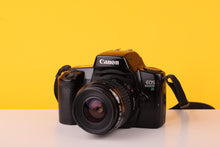 Load image into Gallery viewer, Canon EOS 1000F N 35mm SLR 35mm Film Camera + Canon EF 35-80mm f/4-5.6 Lens
