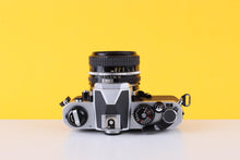 Load image into Gallery viewer, Nikon FM2 35mm SLR Film Camera with Nikon nikkor 50mm f/1.8 Lens
