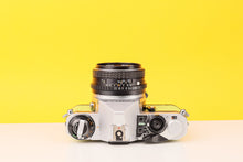 Load image into Gallery viewer, Pentax ME Super 35mm Film Camera with SMC Pentax-M 50mm f/1.7 Lens in Lime Green
