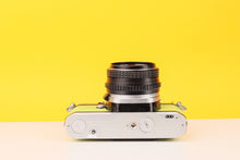 Load image into Gallery viewer, Pentax ME Super 35mm Film Camera with SMC Pentax-M 50mm f/1.7 Lens in Lime Green
