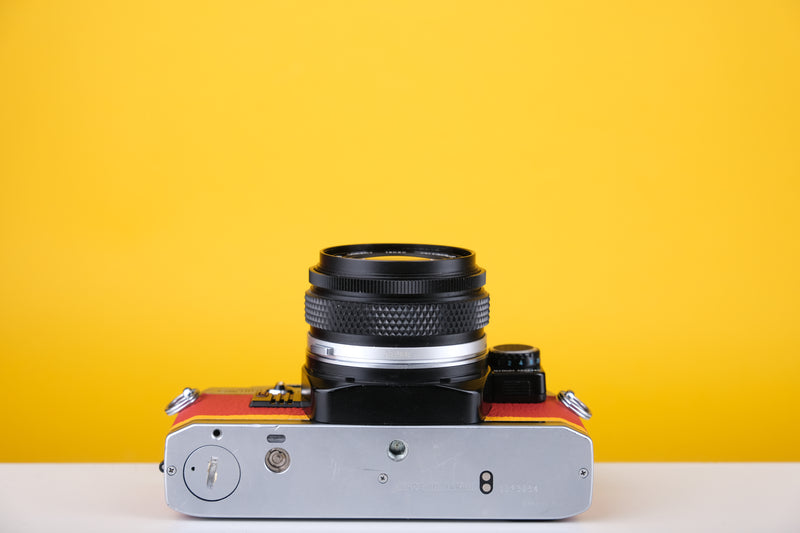 Olympus OM10 35mm SLR Film Camera with Zuiko 28mm f2.8 Prime Lens  and Manual Adapter With New Leather Red and Yellow Skin
