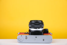 Load image into Gallery viewer, Olympus OM10 Slr Vintage 35mm Film Camera with Zuiko 50mm f1.8 Prime Lens  and Manual Adapter With New Leather Red and Yellow Skin
