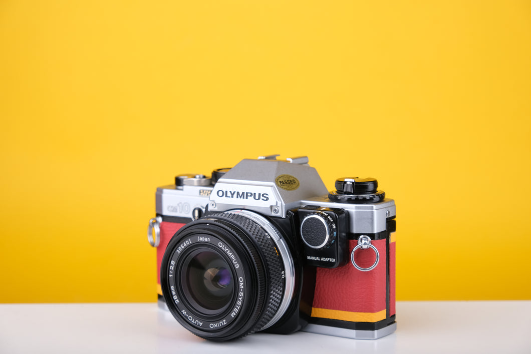 Olympus OM10 35mm SLR Film Camera with Zuiko 28mm f2.8 Prime Lens  and Manual Adapter With New Leather Red and Yellow Skin