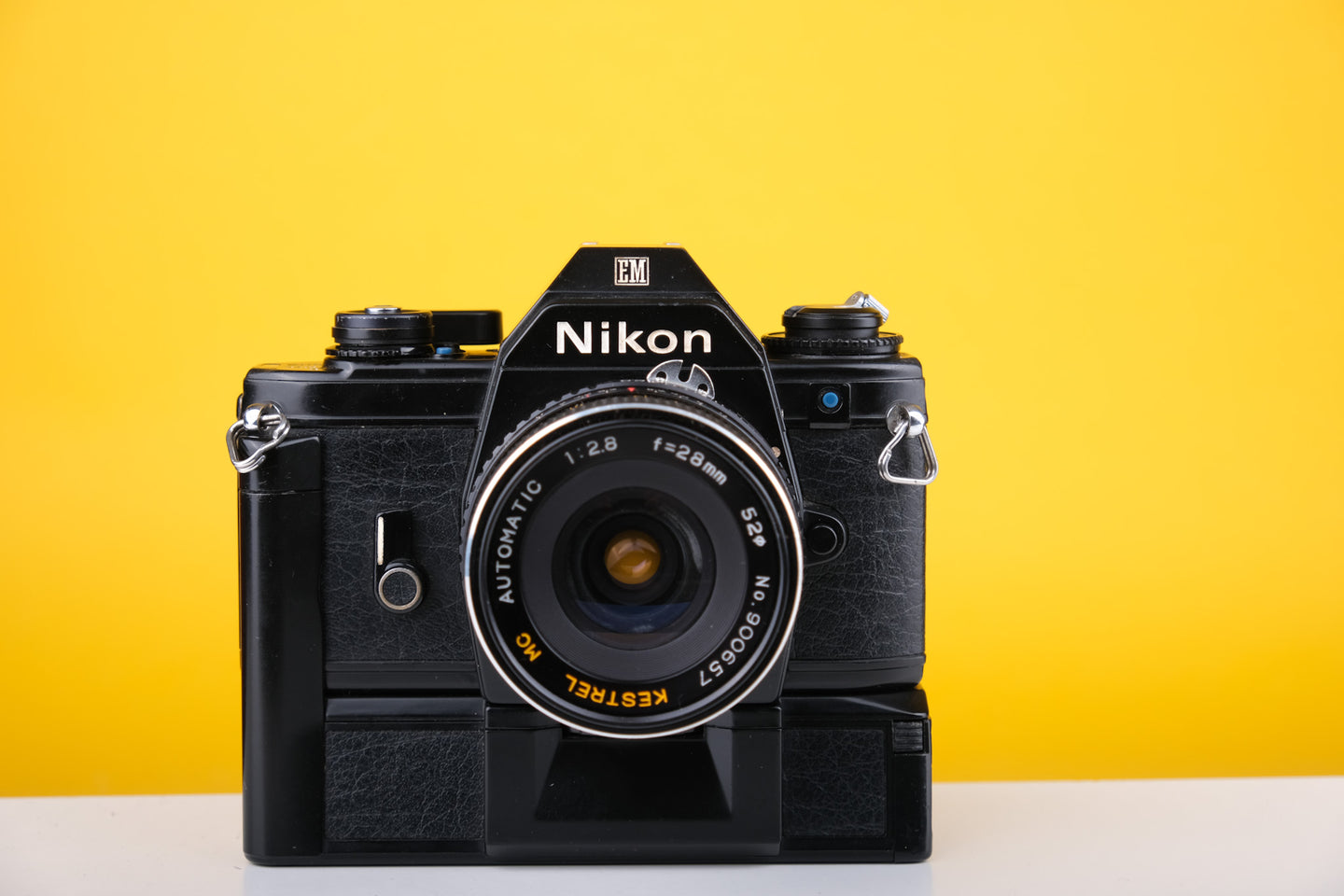  Nikon EM 35mm SLR Film Camera with 28mm lens and Grip