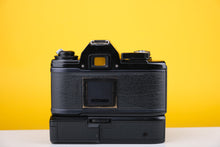 Load image into Gallery viewer, Nikon EM 35mm SLR Film Camera with 28mm lens and Grip
