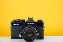 Load image into Gallery viewer, Topcon RE200 35mm SLR Film Camera with 55mm f1.7 Lens
