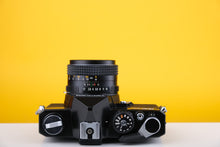 Load image into Gallery viewer, Topcon RE200 35mm SLR Film Camera with 55mm f1.7 Lens
