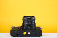 Load image into Gallery viewer, Topcon RE200 35mm SLR Film Camera with 55mm f1.7 Lens
