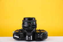 Load image into Gallery viewer, Canon AE-1 35mm SLR Film Camera with Vivitar 28mm f2.8 Lens
