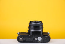 Load image into Gallery viewer, Pentax MG Black 35mm SLR Film Camera with 50mm f2
