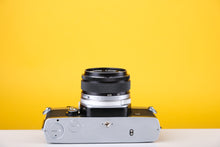 Load image into Gallery viewer, Olympus OM-1n 35mm SLR Film Camera with Zuiko 50mm f1.8 Lens

