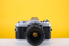 Load image into Gallery viewer, Minolta X-300 35mm SLR Film Camera with 35-70mm f3.5 Lens
