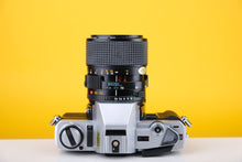 Load image into Gallery viewer, Minolta X-300 35mm SLR Film Camera with 35-70mm f3.5 Lens
