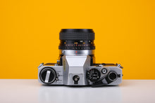 Load image into Gallery viewer, Olympus OM10 35mm SLR Film Camera with Osawa 28mm f2.8 Lens

