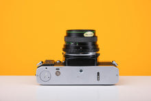 Load image into Gallery viewer, Olympus OM20 35mm Film Camera with Hanimex 28mm f/2.8 Lens
