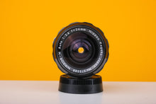 Load image into Gallery viewer, Nikkor-N Auto 24mm f/2.8 Pre AI Lens

