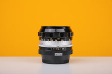 Load image into Gallery viewer, Nikkor-N Auto 24mm f/2.8 Pre AI Lens
