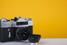 Load image into Gallery viewer, Zenit E Vintage Russian 35mm Film SLR Camera with Industar 50mm f/2Lens and Lens Hood
