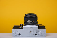 Load image into Gallery viewer, Topcom Super D 35mm Film Camera with Topcor 58mm f/1.8 Lens and Case

