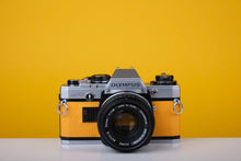 Load image into Gallery viewer, Olympus OM10 Vintage Film Camera with 50mm f/1.8 Lens With New Leather Skin
