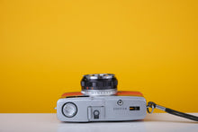 Load image into Gallery viewer, Olympus Trip 35 Vintage 35mm Film Camera with Zuiko 40mm f2.8 Lens and New Orange Leather Skin
