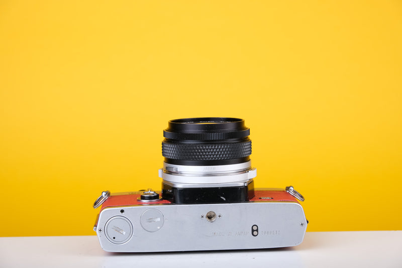 Olympus OM2n MD 35mm Film Camera with Zuiko 28mm f2.8 Lens Filter Reconditioned with Red Leather Skin