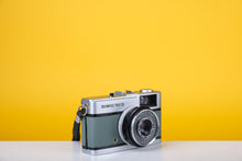 Load image into Gallery viewer, Olympus Trip 35 Vintage 35mm Film Camera with Zuiko 40mm f2.8 Lens and New Grey Leather Skin
