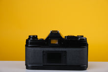 Load image into Gallery viewer, Canon AE-1 Black 35mm SLR Film Camera with Canon Zoom FD 35-70mm f3.5-4.5 Lens
