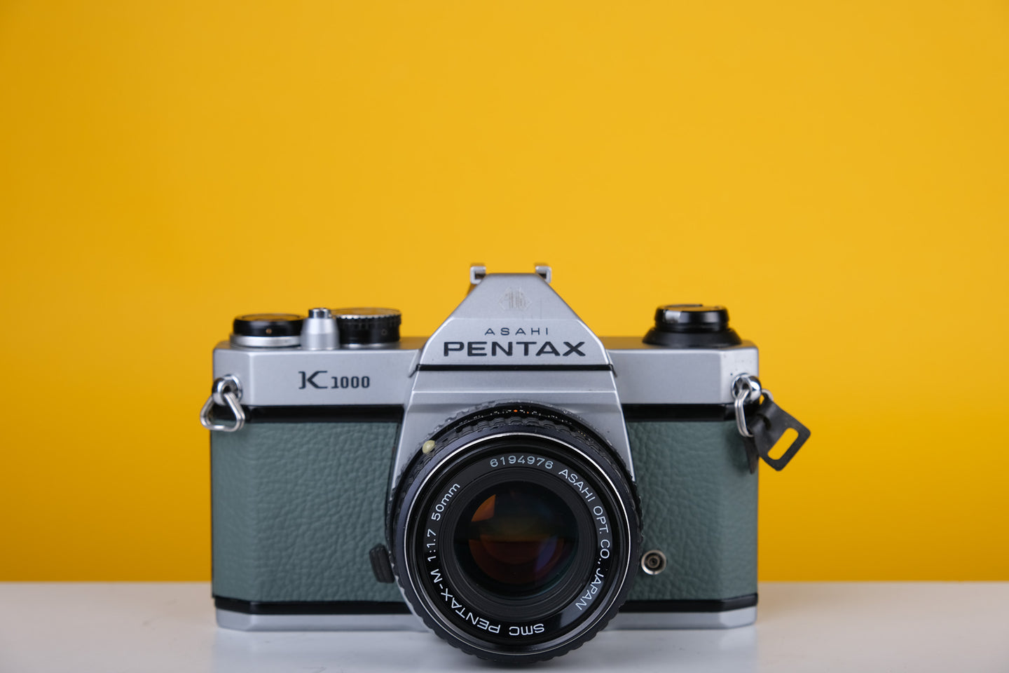 Pentax K1000 35mm Film Camera with SMC Pentax M 50mm f/1.7 Prime Lens and New Grey Leather Skin