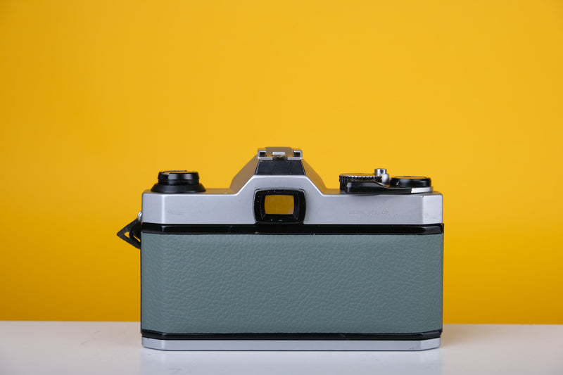 Pentax K1000 35mm Film Camera with SMC Pentax M 50mm f/1.7 Prime Lens and New Grey Leather Skin