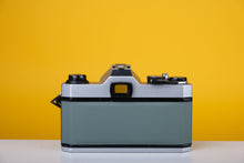Load image into Gallery viewer, Pentax K1000 35mm Film Camera with SMC Pentax M 50mm f/1.7 Prime Lens and New Grey Leather Skin
