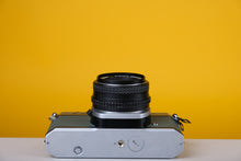 Load image into Gallery viewer, Pentax K1000 35mm Film Camera with SMC Pentax M 50mm f/1.7 Prime Lens and New Grey Leather Skin
