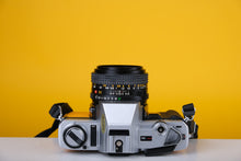 Load image into Gallery viewer, Minolta X-300 Silver 35mm SLR Film Camera with 50mm f1.7 Lens
