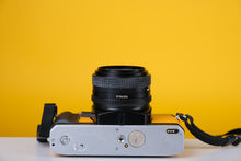 Load image into Gallery viewer, Minolta X-300 Silver 35mm SLR Film Camera with 50mm f1.7 Lens
