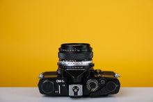 Load image into Gallery viewer, Olympus OM-1n Black 35mm Film Camera with Zuiko 28mm f2.8
