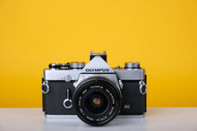 Load image into Gallery viewer, Olympus OM-1n 35mm SLR Film Camera with Zuiko 28mm f2.8 Lens
