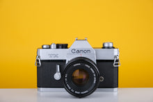 Load image into Gallery viewer, Canon TX 35mm SLR Film Camera with Canon FD 50mm f/1.8 Prime lens
