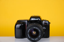 Load image into Gallery viewer, Nikon N50 35mm SLR Film Camera with Sigma 24-70mm f3.5-5.6 Lens
