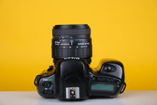 Load image into Gallery viewer, Nikon N50 35mm SLR Film Camera with Sigma 24-70mm f3.5-5.6 Lens
