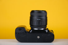 Load image into Gallery viewer, Nikon N50 35mm SLR Film Camera with Sigma 24-70mm f3.5-5.6 Lens
