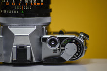 Load image into Gallery viewer, Canon AE-1 Vintage 35mm SLR Film Camera With 50mm F1.4 Prime Lens
