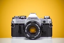 Load image into Gallery viewer, Canon AE-1 Vintage 35mm SLR Film Camera With 50mm F1.8 Prime Lens
